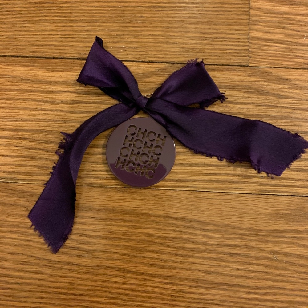 CH Carolina Herrera purple frayed ribbon pin